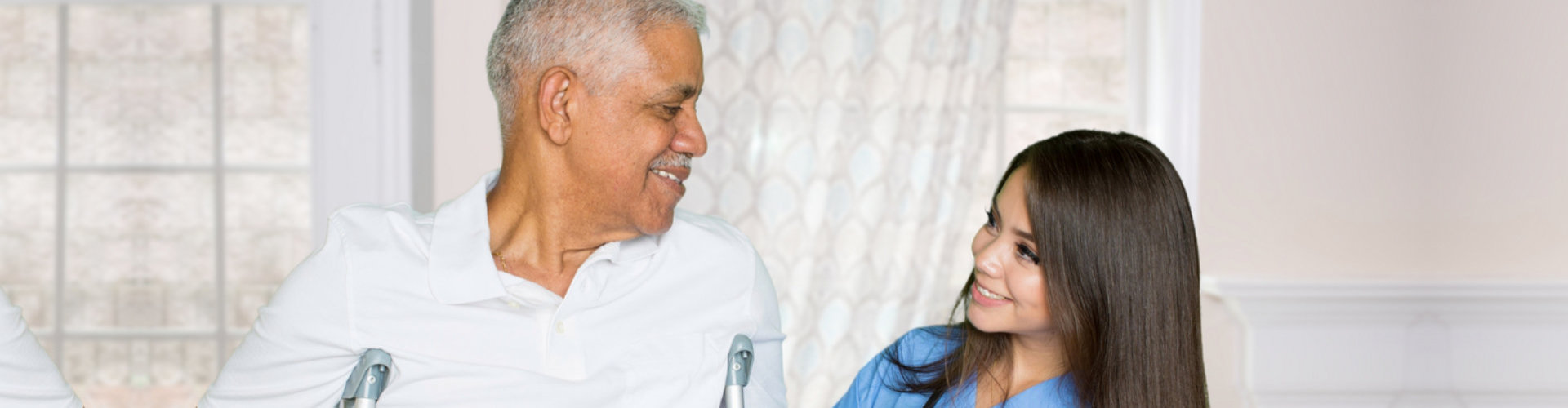 female nurse and senior man smiling