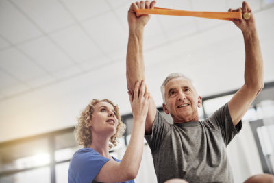 nurse assisting senior man